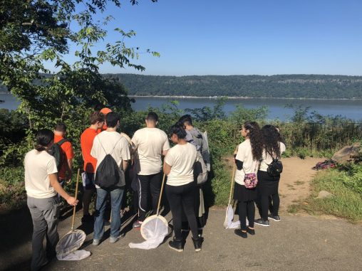 Students overlook the Hudson River from Inwood Hill Park