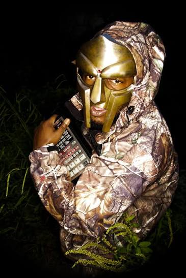 New York rapper mf doom holding a piece of audio equipment