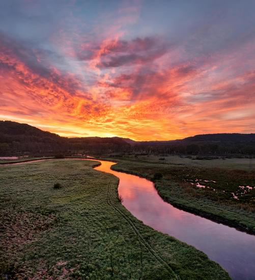 Sunset landscape and a narrow river