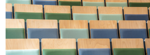Lecture hall seats with blue and green cushions