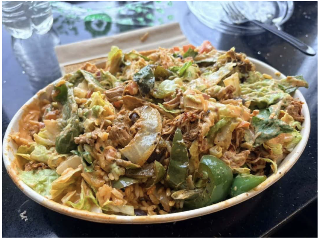 Two select bowls at Guac Time, showcasing its customizable variety. Both bowls are layered with proteins, fresh vegetables, and toppings for a visually appealing (and tasty!) look.