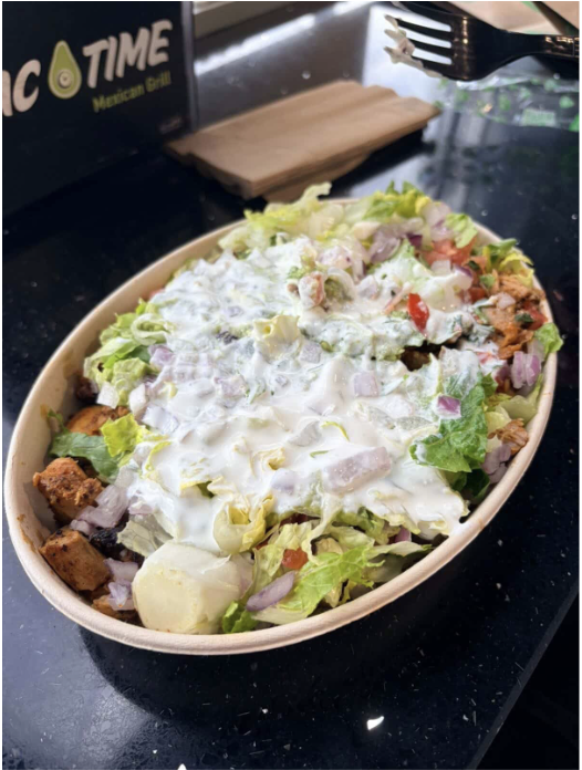 Two select bowls at Guac Time, showcasing its customizable variety. Both bowls are layered with proteins, fresh vegetables, and toppings for a visually appealing (and tasty!) look.