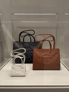 3 Telfar faux leather tote bags in cream, tan, and black