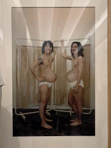 two men in an altered image to show them pregnant