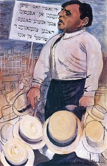 Man standing above a group of protestors and Yiddish sign