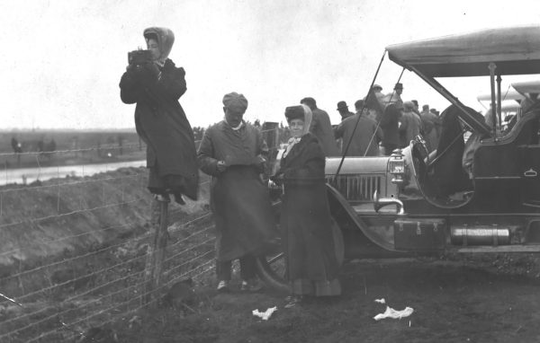 Alice Austin taking photographs outdoors in New York, showing her work as an early female photographer.
