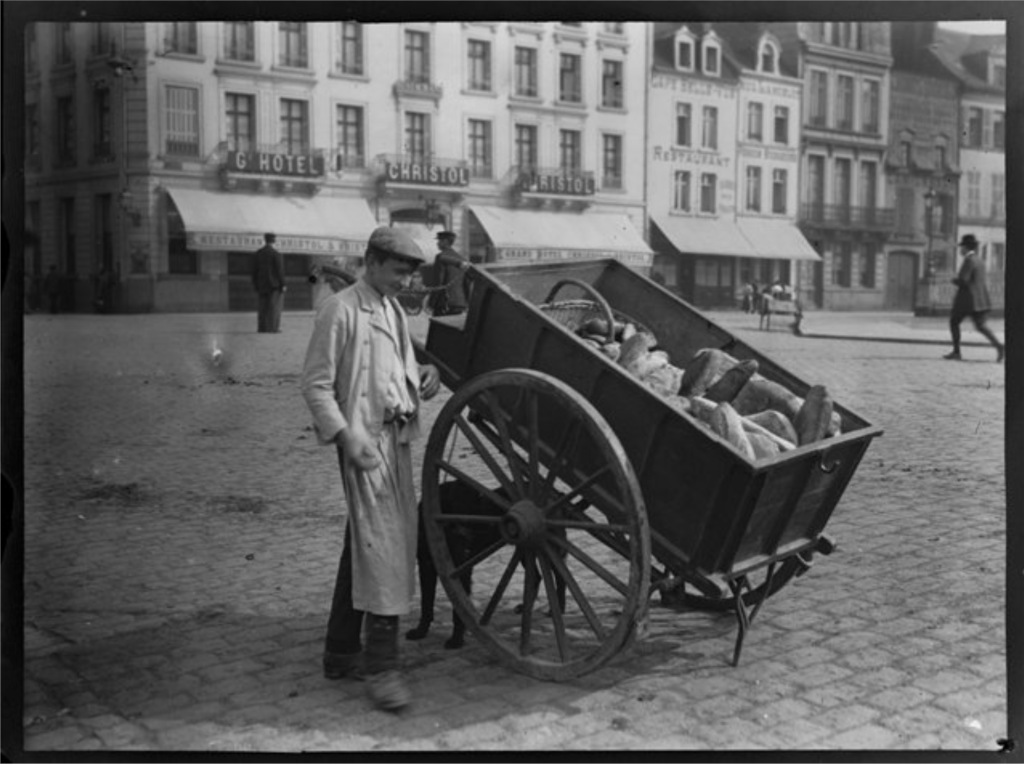 Man with pushcart of bread, photo by Alice Austen, 1909