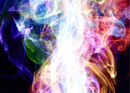 Tendrils of multi-colored steam rise against a black background