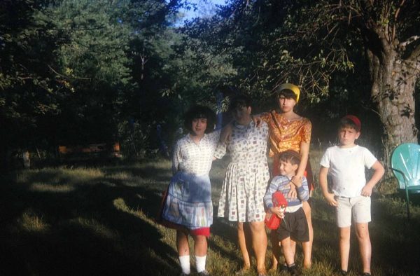 A photograph of my grandmother and her siblings as children, posing for a picture on a summer day in the mid 1960s in the Catskills